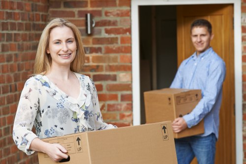 Removal team handling a home move in Harringay with furniture and boxes