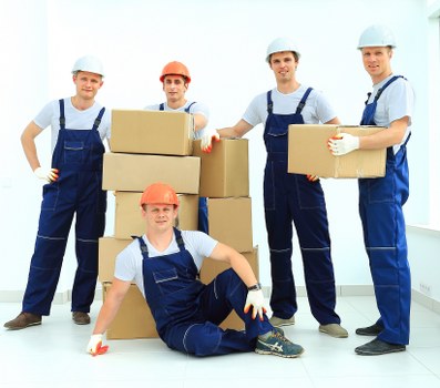 Professional movers handling furniture in a Harringay property
