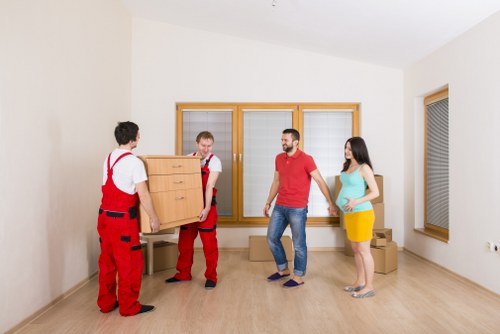 Professional movers handling furniture during a local Harringay relocation