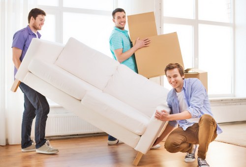 Careful unloading of student furniture and boxes at a North London property