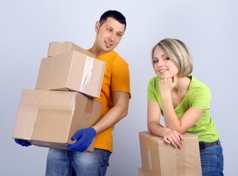 Packed office boxes and furniture ready for relocation in Harringay