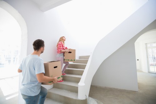 Removal team estimating cubic-yard volume for household items