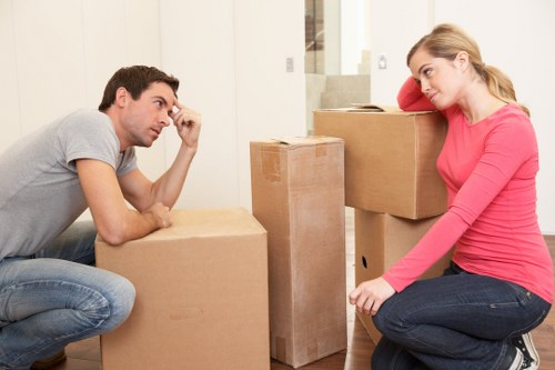 Local moving truck loading household furniture and boxes in North London