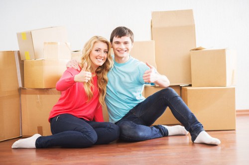 Loading household furniture into a removals vehicle in Harringay