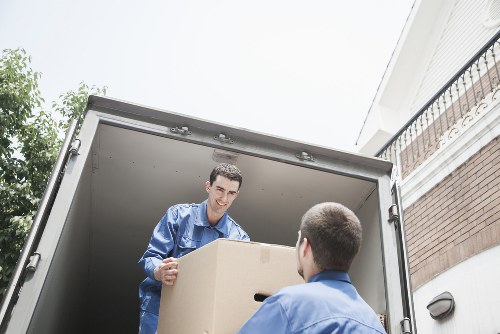 Business relocation planning with packing boxes and labelled equipment for a Harringay move