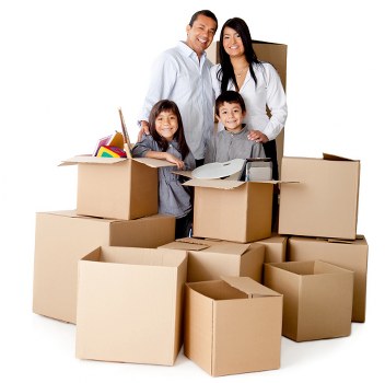 Student moving essentials including boxes, desk, and electronics prepared for relocation